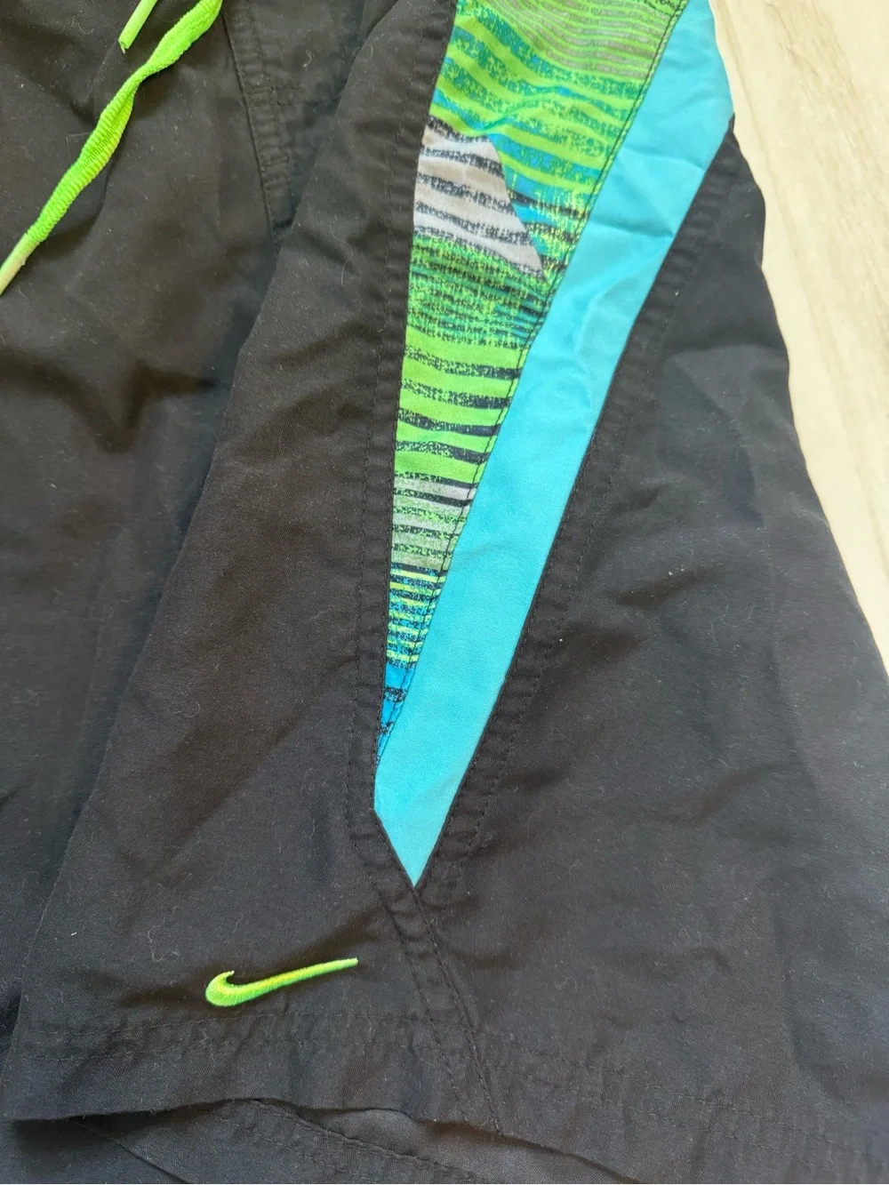 Nike Black Athletic Shorts with Neon Green Drawstring and Teal Accents